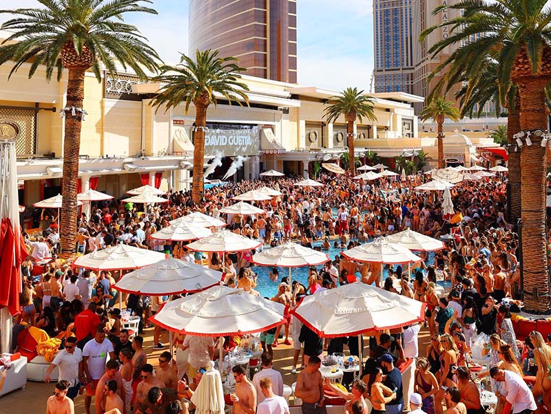 sachin and babi light blue dress Encore Beach Club Bottle Service Pricing & Table Reservations main image 1